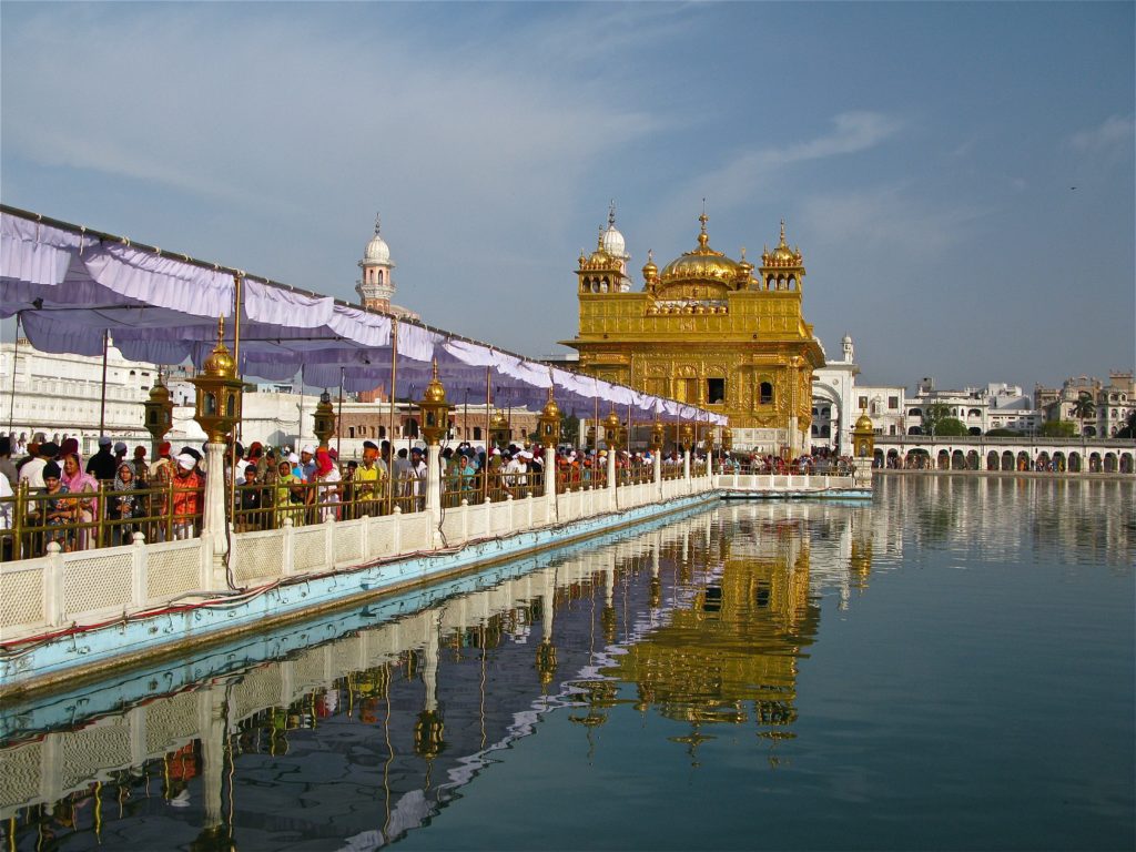 Devotees queue to enter the Golden Temple