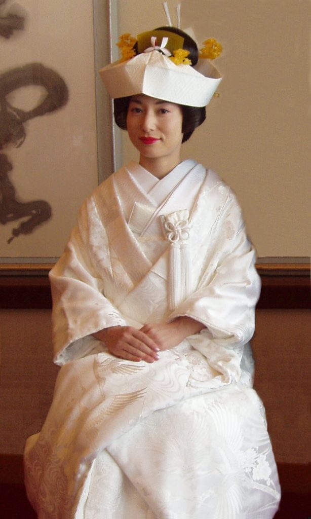 A Japanese bride in shiromuku (white kimono) and tsunokakushi (headdress)