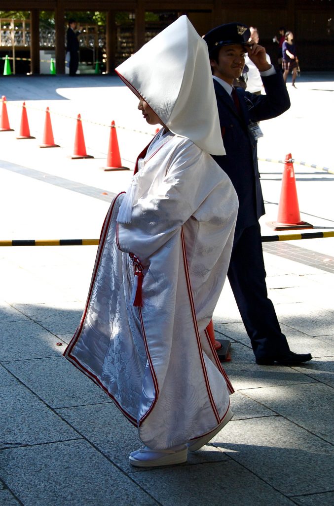 A Japanese bride in shiromuku (white kimono) and wataboshi (headdress)