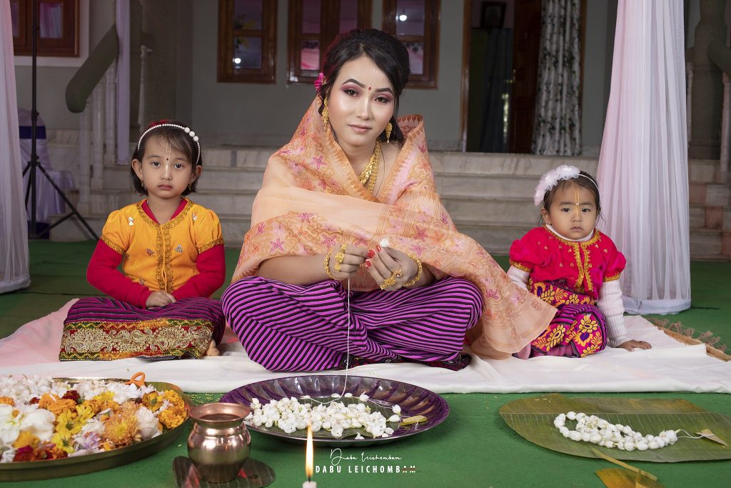 The Manipuri bride weaves a garland for herself and the groom for the Leilenga ritual