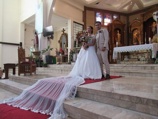Mexican Couple In Front Of The Altar