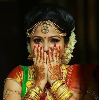 Ezhava Bride with Henna Designs on Hands