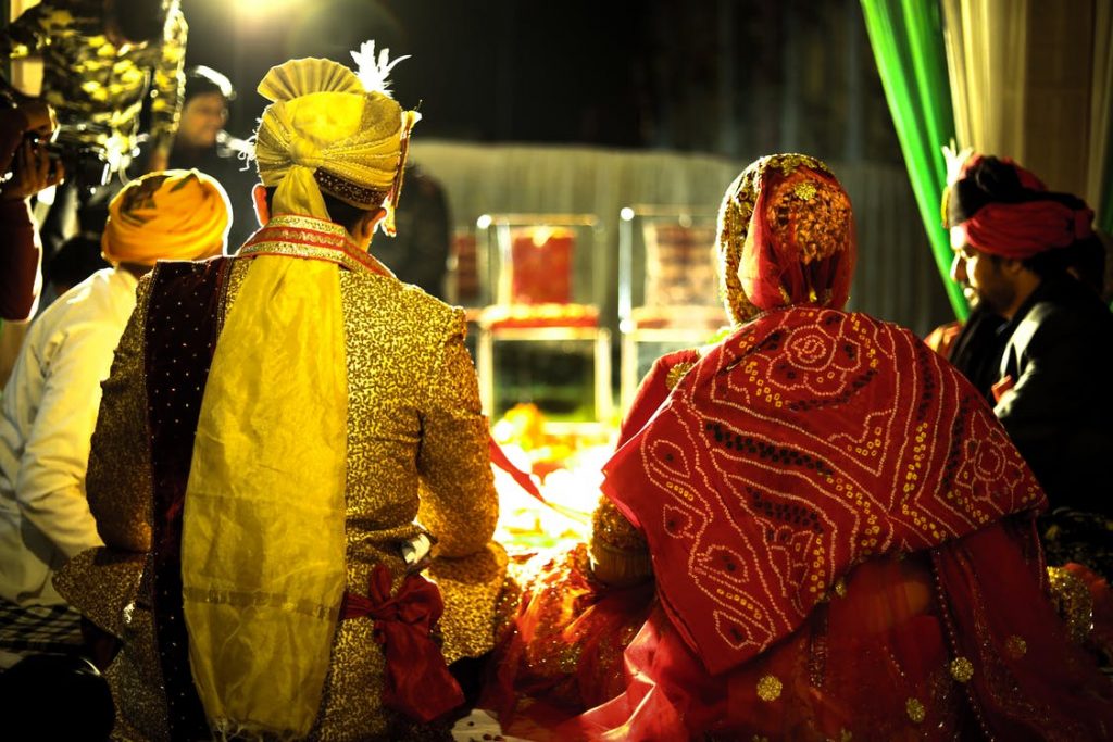 Couple Seated Beside Each Other During The Ceremony